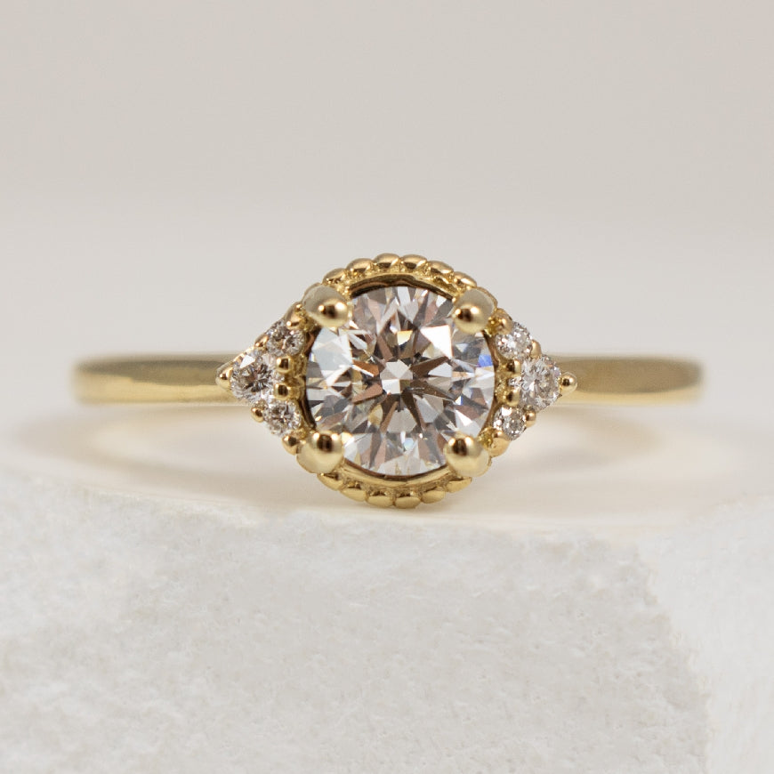 14KY 0.72ct Diamond Vintage Engagement Ring          

14K Yellow Gold Lab Grown Diamond Vintage-Style Accented Engagement Ring

Center - 0.72 Carat Round Brilliant Cut Lab Grown Diamond SI2 Clarity, D Colour, Very Good Cut

Accent 0.088 Carats