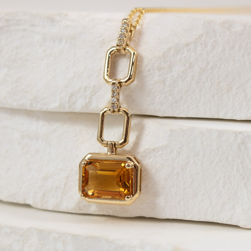 10K Citrine & Diamond Drop Necklace 

8x6MM Emerald Cut Citrine

0.03 Total Natural Diamond Weight 

