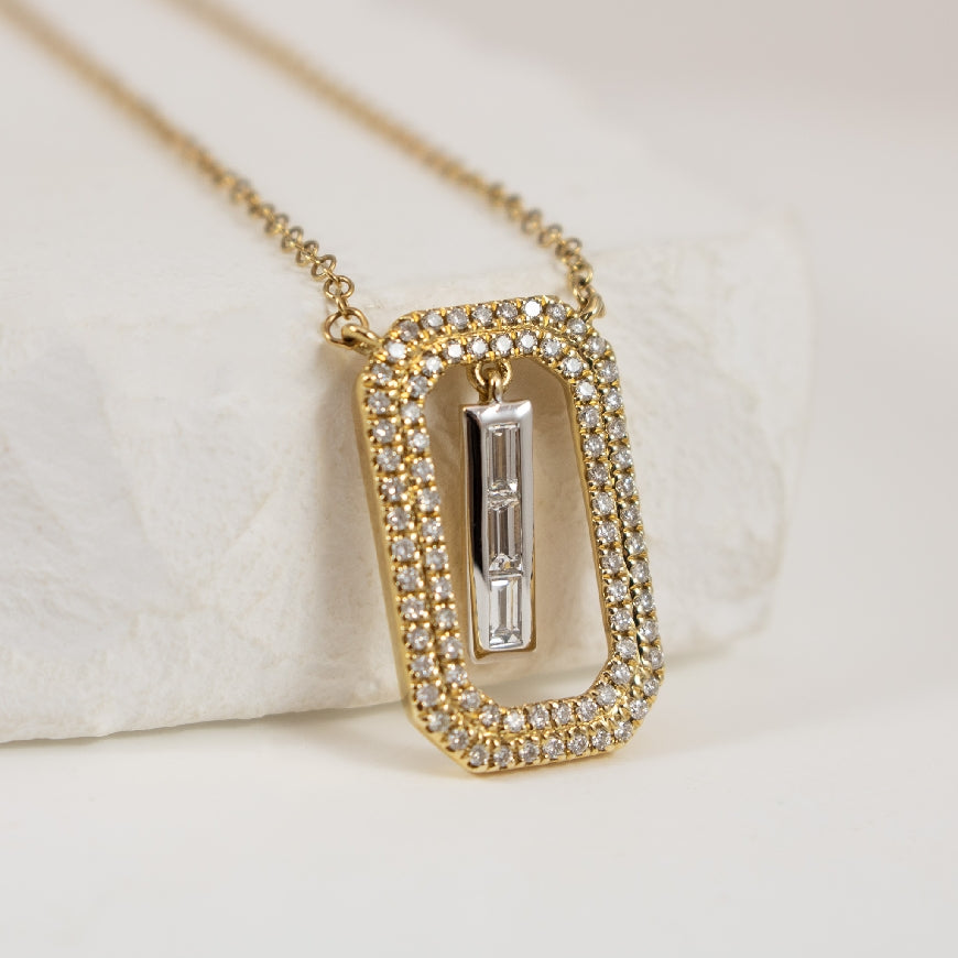 14K Yellow & White Gold Diamond Frame Necklace 

0.13 Total Natural Baguette Cut Diamond Weight 
0.20 Total Natural Round Brilliant Cut Diamond Weight of SI+ Clarity, G Colour

Chain Length 18' (Adjustable to 16')