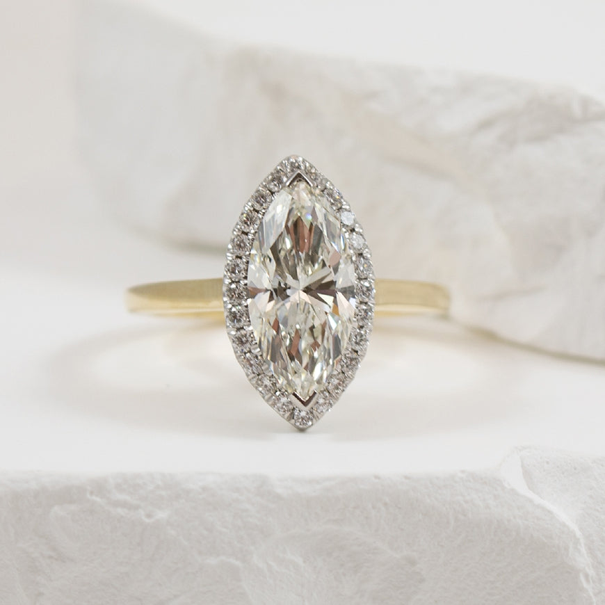 14KY 2.04CT Marquise Halo Diamond Engagement Ring 

14K Yellow Gold Marquis Lab Grown Diamond Halo Engagement Ring 
 
Center - 2.04 Carat Marquis Cut Lab Grown Diamond of 
VS1 Clarity, F Colour, Excellent Cut, CGL Certified 

Accent - 0.24 Car