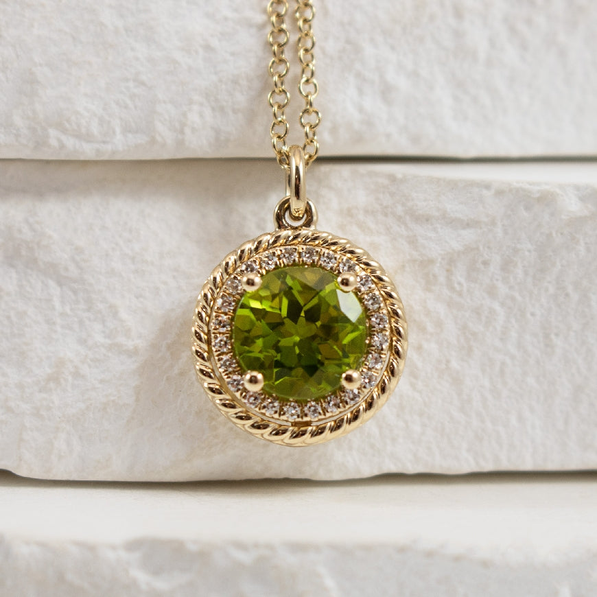 14KY Diamond & Peridot Necklace 

14K Yellow Gold Natural Diamond & Peridot Halo Pendant 

1.26 Carat Round Cut Peridot 

0.07TDW SI Clarity, GH Colour 