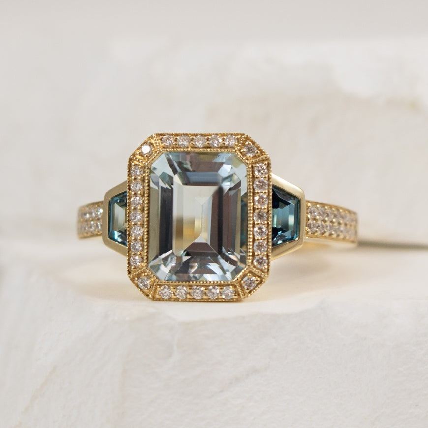 14KY Diamond Aquamarine & London Blue Topaz Ring 

14K Yellow Gold Natural Diamond, Aquamarine & London Blue Topaz Three Stone Ring  

2.21 Carat Emerald Cut Aquamarine 

0.41 Carat Total Weight London Blue Topaz   

0.22TDW SI Clarity, GH Co