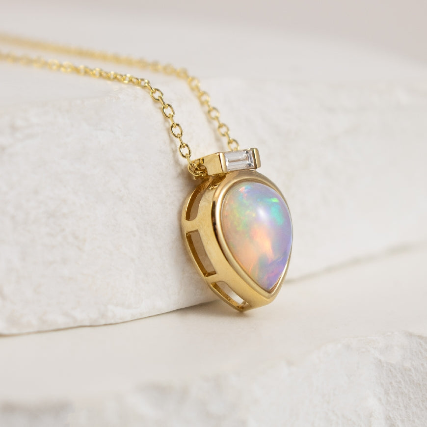 14K Yellow Gold Pear Shaped Bezel Set Opal Necklace with Baguette Diamond Accent Attached to Cable Chain 