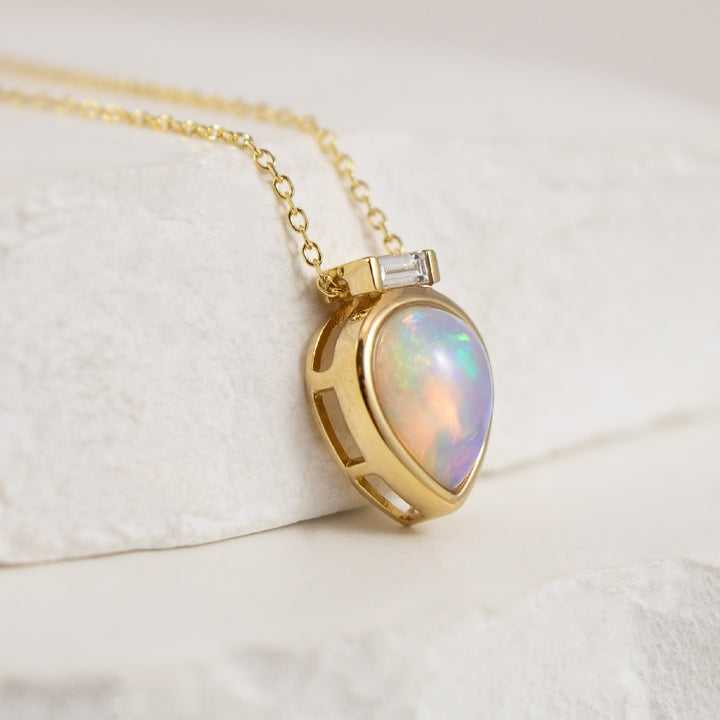 14K Yellow Gold Pear Shaped Bezel Set Opal Necklace with Baguette Diamond Accent Attached to Cable Chain 