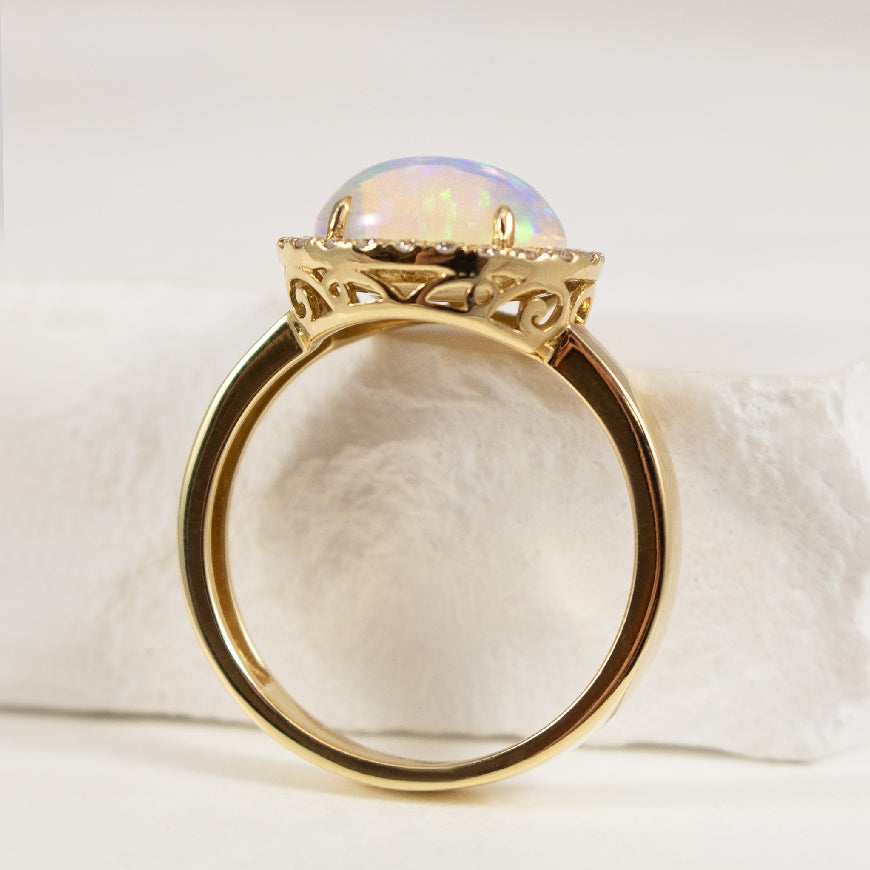 14K Yellow Gold Large Opal Ring with Diamond Halo and extra Detailing on Basket of Ring